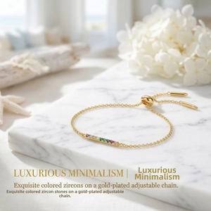 Detail of adjustable gold-plated box chain with seven vibrant multicolored cubic zirconia