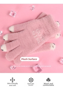 Detail of pink plush gloves with cute animal paw design and soft faux mink texture