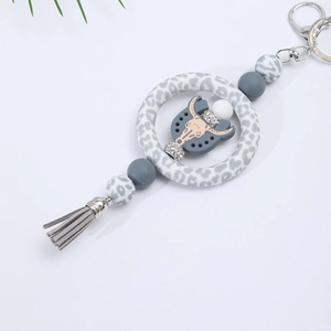 Leopard print silicone keychain with rhinestone bull skull charm and grey tassel decor