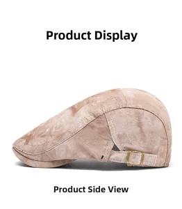 Detail of adjustable vintage bronze buckle and leather strap on khaki newsboy cap