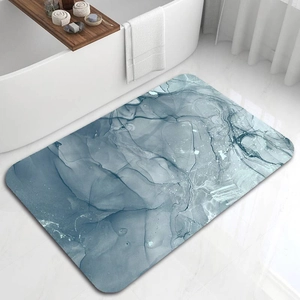Detailed close-up of marble pattern bath mat with non-slip texture near a modern bathtub