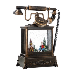 Vintage bronze telephone Christmas snow globe with Santa Claus and festive village scenery