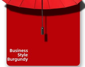 Detail of burgundy business umbrella canopy with matte black handle and arrow button