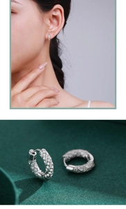 Detailed view of silver twisted hoop earrings with micro-pave sparkling cubic zirconia