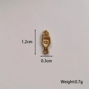 Macro detail of gold Hamsa Hand pendant with evil eye showing size and weight specs