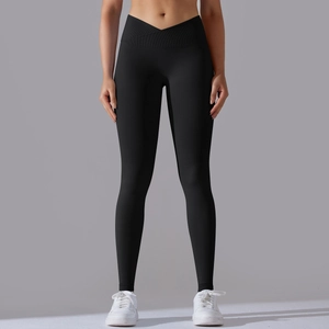 Detail of high-waisted seamless yoga leggings with V-shaped crossover waistband