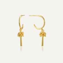 Detail of 14K gold plated S925 silver earrings with tropical palm tree design and pearl