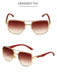 Detail of square gold metal sunglasses with gradient tea lenses and wood texture temples