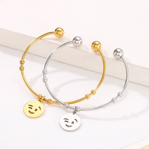 Minimalist gold and silver titanium steel bangles featuring smiley face charms for women
