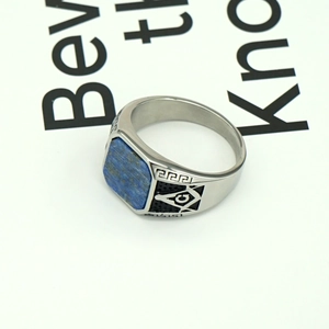 Detailed side view of silver titanium steel ring with blue lapis and Masonic emblem