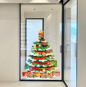 Detail of creative green Christmas tree glass sticker with ornaments and gift boxes
