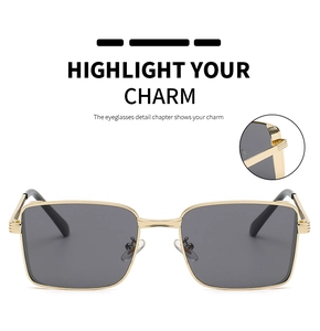 Detail view of gold metal square sunglasses frame showing durable hinge craftsmanship