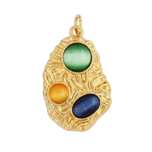 Macro view of gold lava texture pendant with three colorful stones and size specs