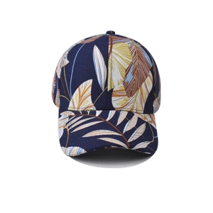 Navy blue baseball cap with tropical leaf print and curved brim for outdoor sun protection