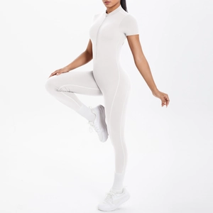 Detail of light grey yoga bodysuit showing stretch fabric and front zipper closure