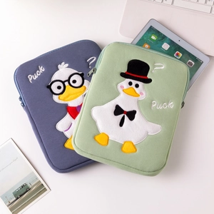 Detailed embroidery of cartoon Puck duck on quilted laptop and tablet sleeve