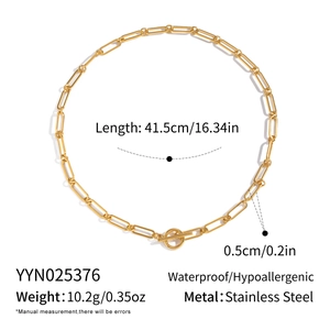 Detail view of golden stainless steel paperclip chain necklace with toggle clasp features