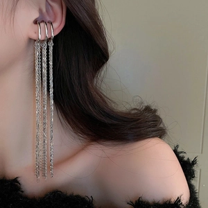 Detail of silver long tassel ear cuff clip showing the layered metal chains on ear