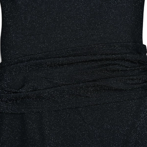 Detail of dark blue shimmering fabric with elegant ruched design and glitter texture