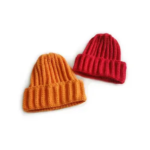 Classic ribbed knit beanies in orange and red for men and women, cozy winter headwear