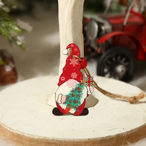 Wooden Christmas gnome ornament with red hat and gift box for festive tree decoration
