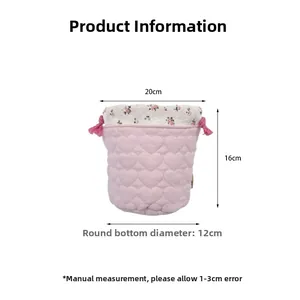 Pink heart quilted storage bag with floral drawstring top and size dimensions of 20x16cm
