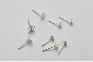 Macro shot of S925 sterling silver plum blossom earring studs with authentic S925 hallmark