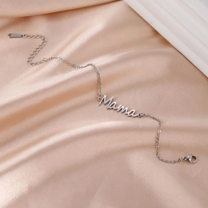 Elegant stainless steel Mama pendant bracelet with adjustable chain on satin fabric