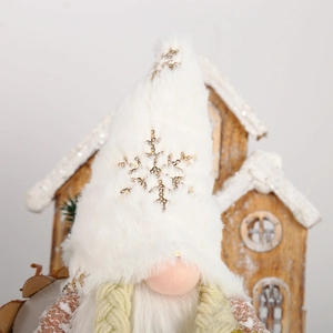 Detail of Christmas gnome plush hat featuring gold sequin snowflake and white faux fur