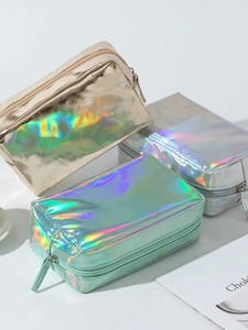 Three colorful laser PU cosmetic bags with metallic zippers in gold, silver, and mint green