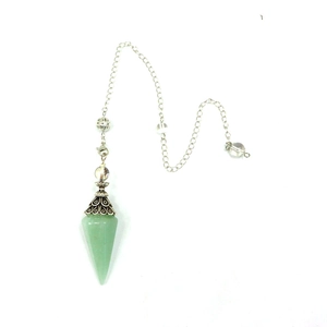 Detailed view of green crystal hexagonal pendulum with vintage silver carved metal cap