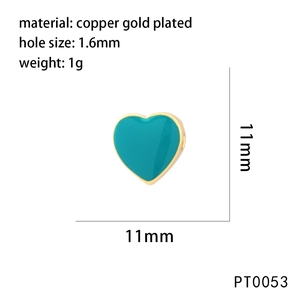 Detail of turquoise heart charm in gold-plated copper with 11mm size and 1.6mm hole