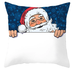 Close-up of a festive Christmas pillowcase with Santa Claus and snowflakes on blue fabric
