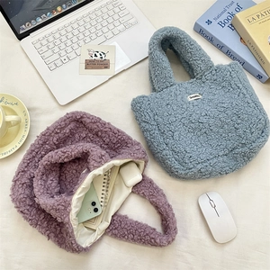 Detail of plush lamb wool handbags showing internal storage for phone and stationery