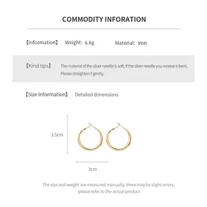 Detailed view of silver needle metal hoop earrings measuring 3.5cm by 3cm in diameter