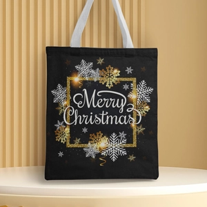 Detail of black Christmas canvas handbag with golden snowflake print and Merry Christmas text