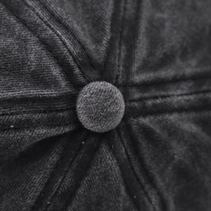 Macro shot of dark gray cotton twill fabric texture and stitching on top of the baseball cap