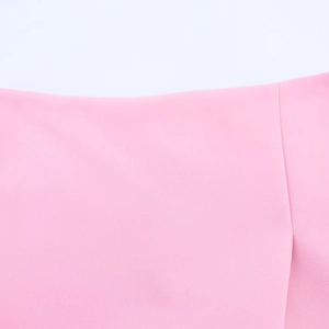 Close-up of pink split skirt-pants showing fabric texture and elastic waistband detail
