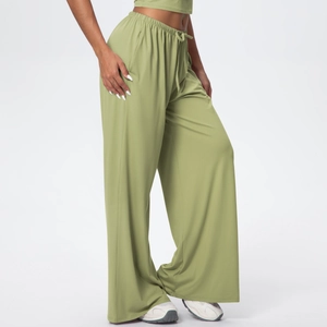 Detail of high waisted wide leg yoga pants showing drawstring elastic waistband and side pocket