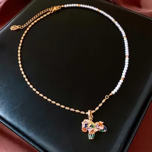 18K gold plated horse necklace featuring faux pearls and colorful crystal gemstones