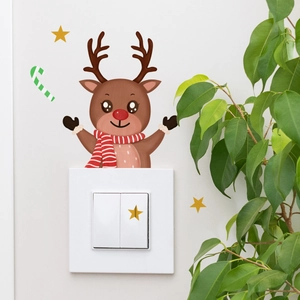 Luminous reindeer wall sticker with stars and candy cane above light switch decor