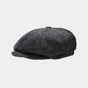Detail view of the retro grey herringbone newsboy cap with wool blend texture