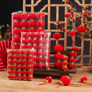 Mini red flocked lanterns with gold accents and tassels for Chinese New Year decor
