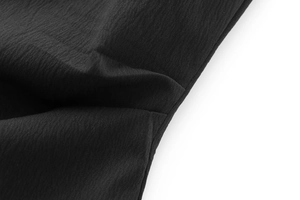 Macro shot of black ribbed fabric texture for this strapless dress showing weave details