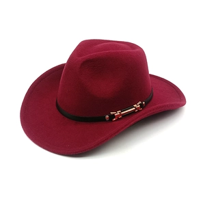 Detail view of burgundy felt cowboy hat with black leather band and metal buckle