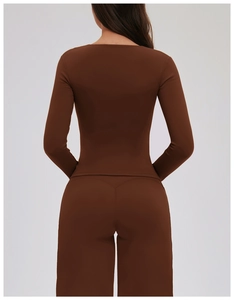 Rear view of brown long sleeve yoga top and leggings showing slim fit and back line