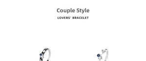 Detailed view of silver astronaut couple ring with blue star and planet elements
