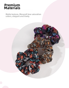 Three Halloween scrunchies with vintage skeleton and graffiti patterns in festive colors