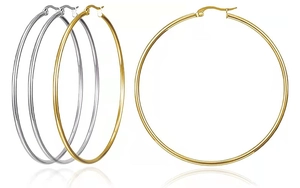Detail showing classic large gold and silver polished hoop earrings on a plain background