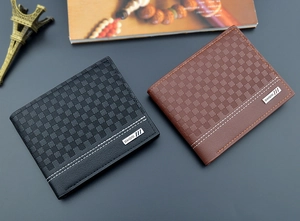 Close-up of black and brown plaid textured men's wallets with contrast stitching and metal logo
